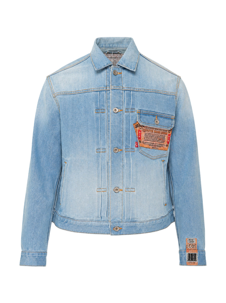 doublet Air Yarn Faded Denim Jacket in light-wash blue with archival printed patch labels on the chest pocket and cuff, featuring amber topstitching and gunmetal button fastening