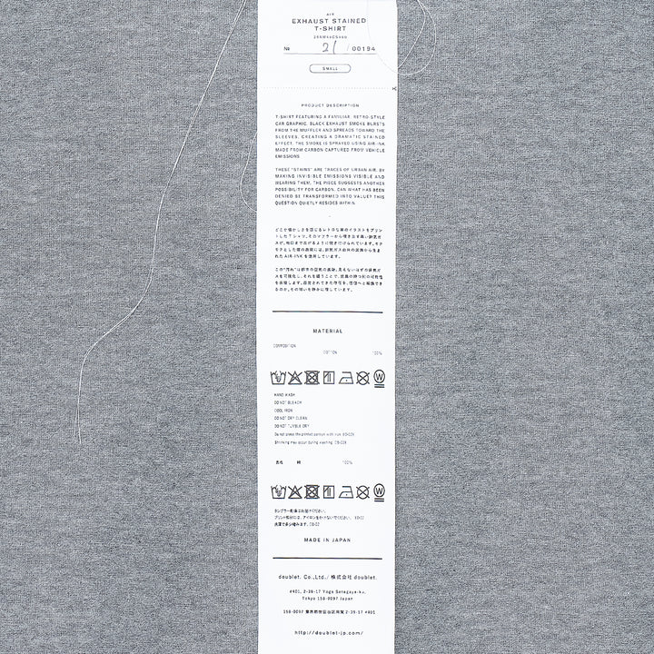 doublet Exhaust Stained Tee in grey marl with shadow dye effect and a retro red sports car graphic on the chest, FW26
