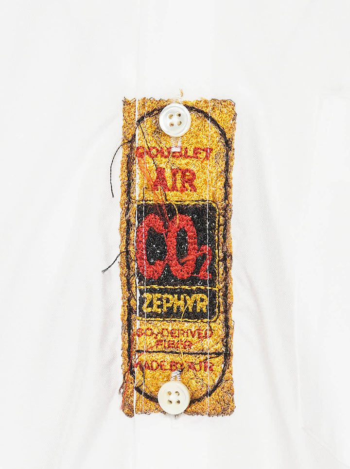 doublet Air Yarn Long Sleeve Shirt in white with embroidered CO2 Zephyr patch on the chest and repeated CO2 stamp graphic on the lower front, shown flat on a white background - view 3