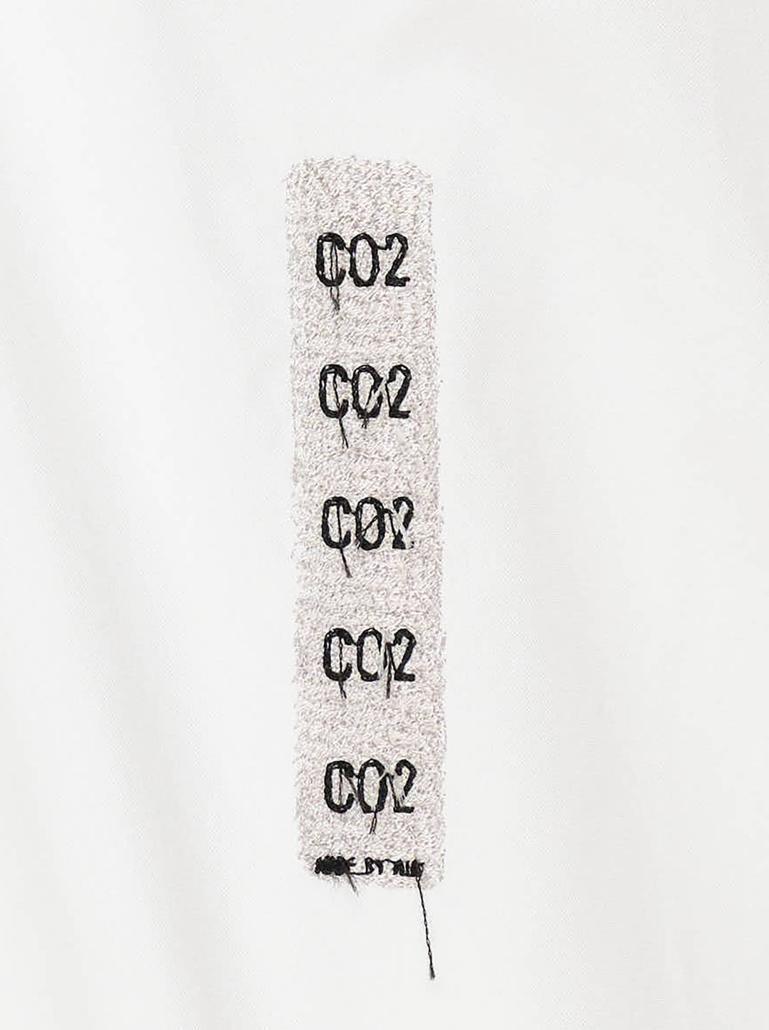 doublet Air Yarn Long Sleeve Shirt in white with embroidered CO2 Zephyr patch on the chest and repeated CO2 stamp graphic on the lower front, shown flat on a white background - view 4