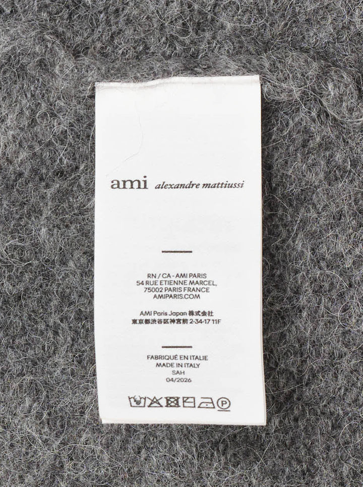 AMI grey bouclé knit polo sweater with spread collar, three-button placket, and ribbed cuffs, displayed on a flat ghost mannequin - view 3