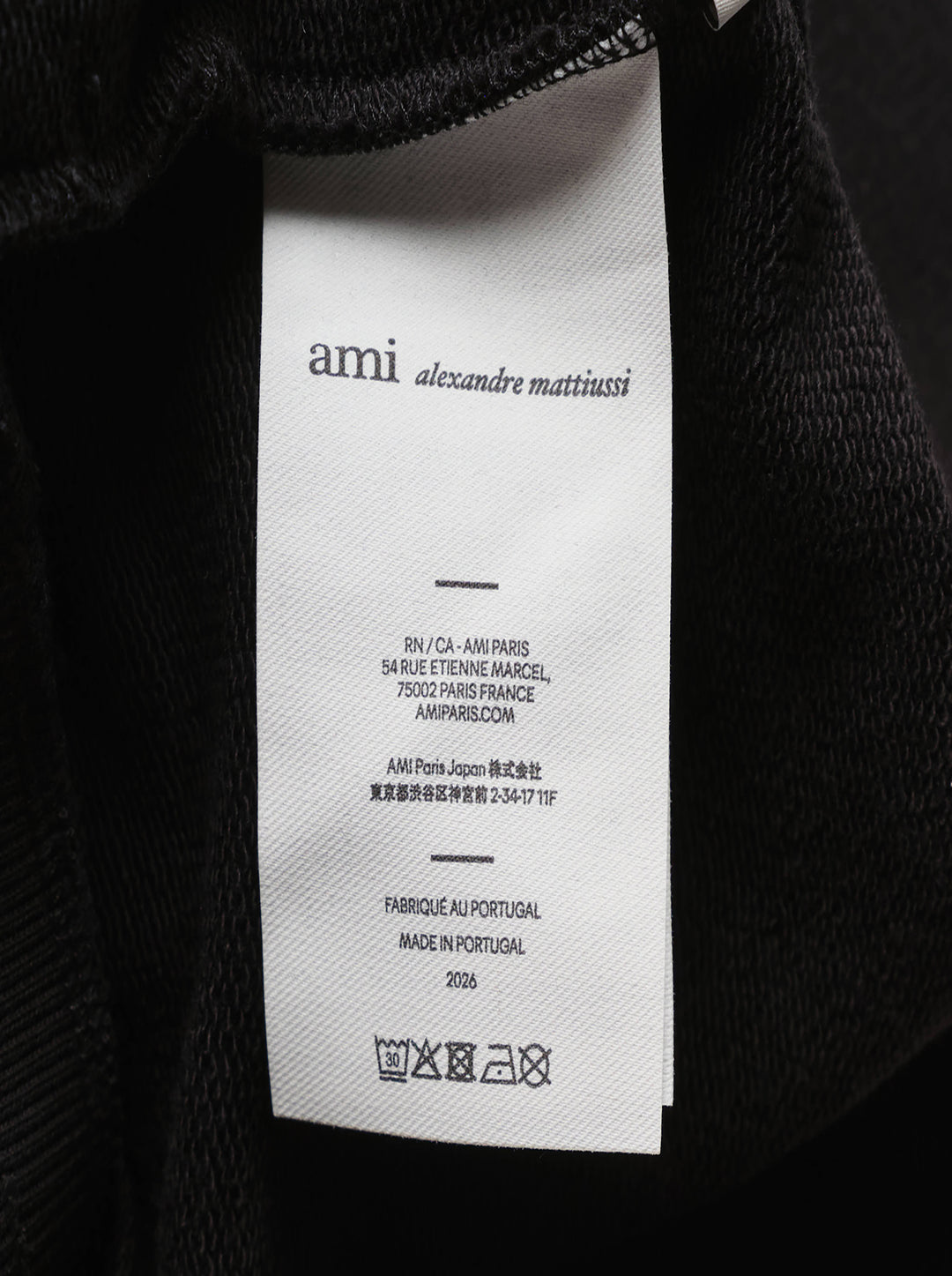 AMI Contrast Wide Leg Sweatpants in black with elasticated drawstring waistband and wide straight-cut silhouette, shown flat against a white background - view 4