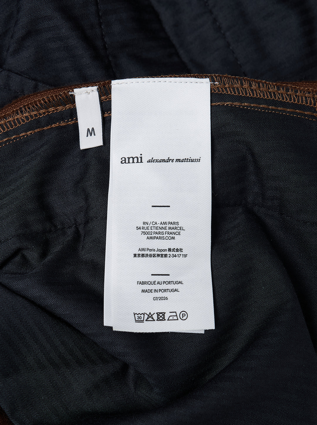 AMI Parisian Fit Trousers in brown fine-wale corduroy with a straight leg silhouette, structured waistband and twin button fastening, front view on white background - view 3