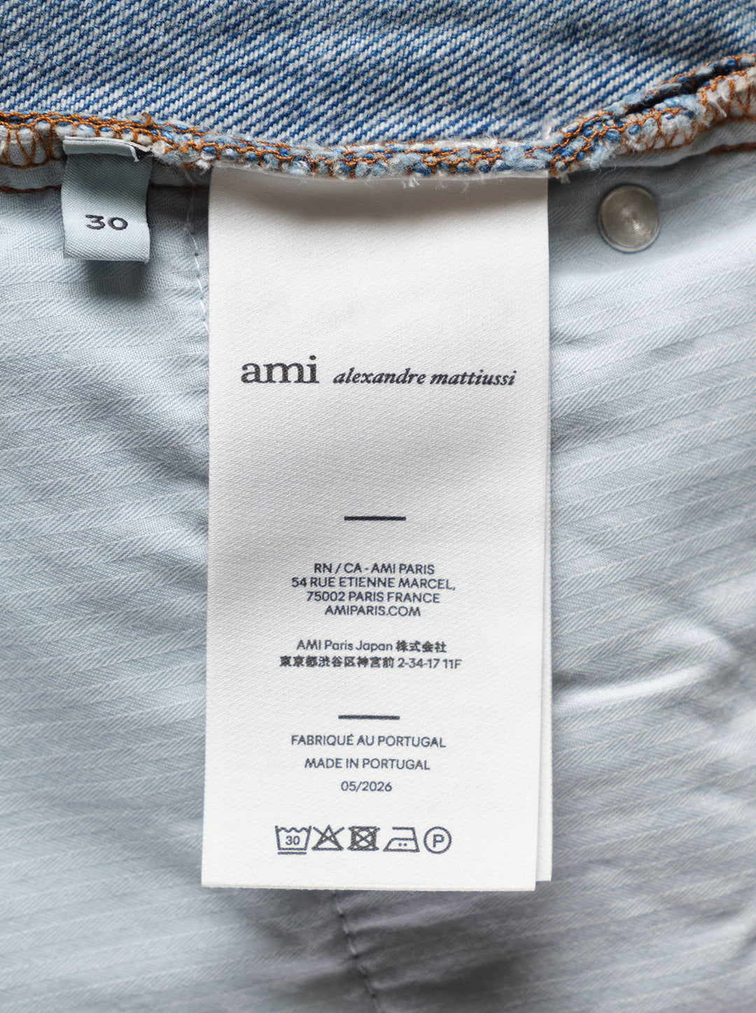 AMI Large Fit Jeans in light blue stonewash denim, featuring a relaxed wide-leg silhouette, five-pocket construction, and contrast copper topstitching - view 3