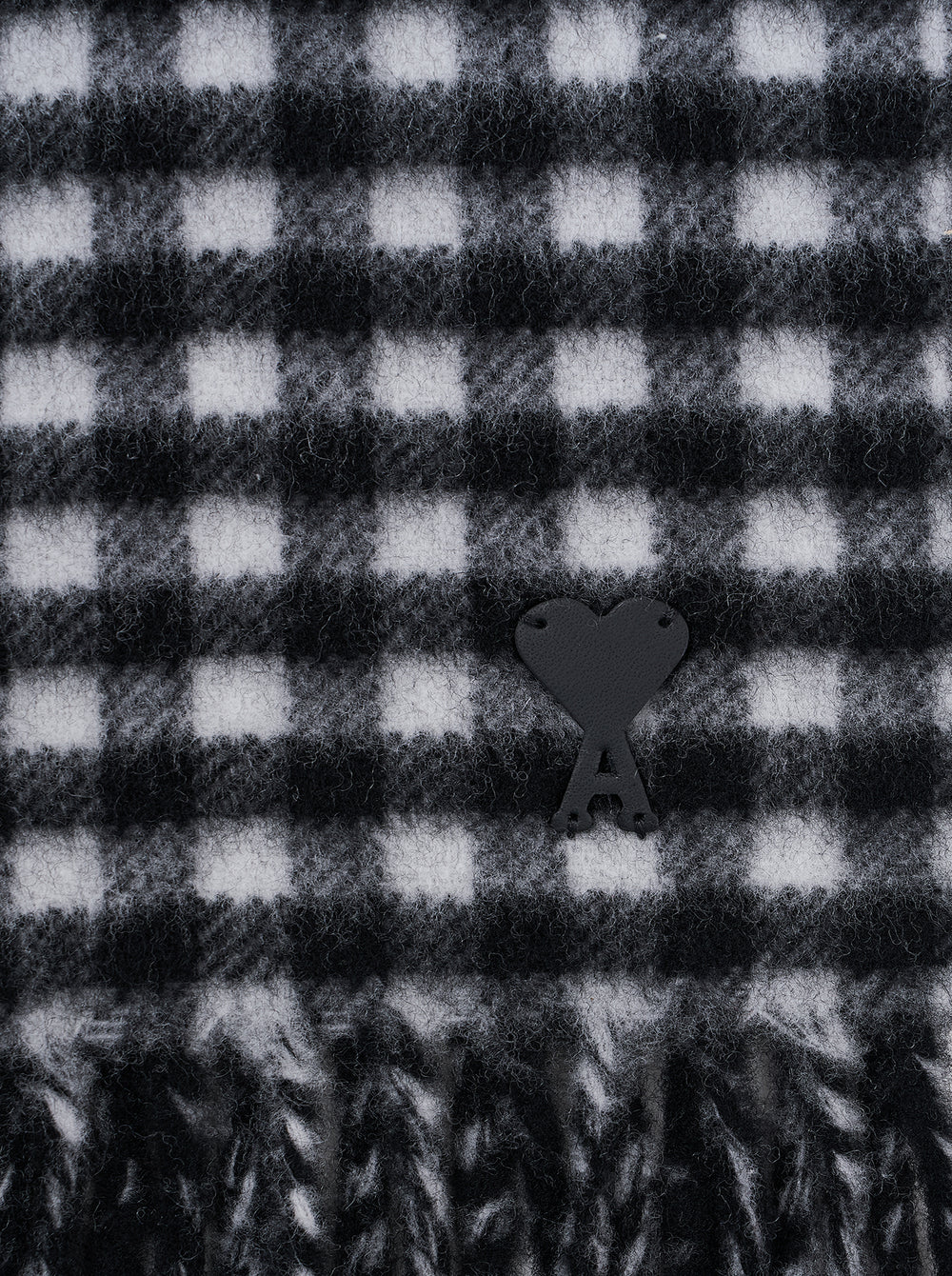 AMI Ami de Coeur black and white gingham check scarf with fringed ends, laid flat against a white background - view 2