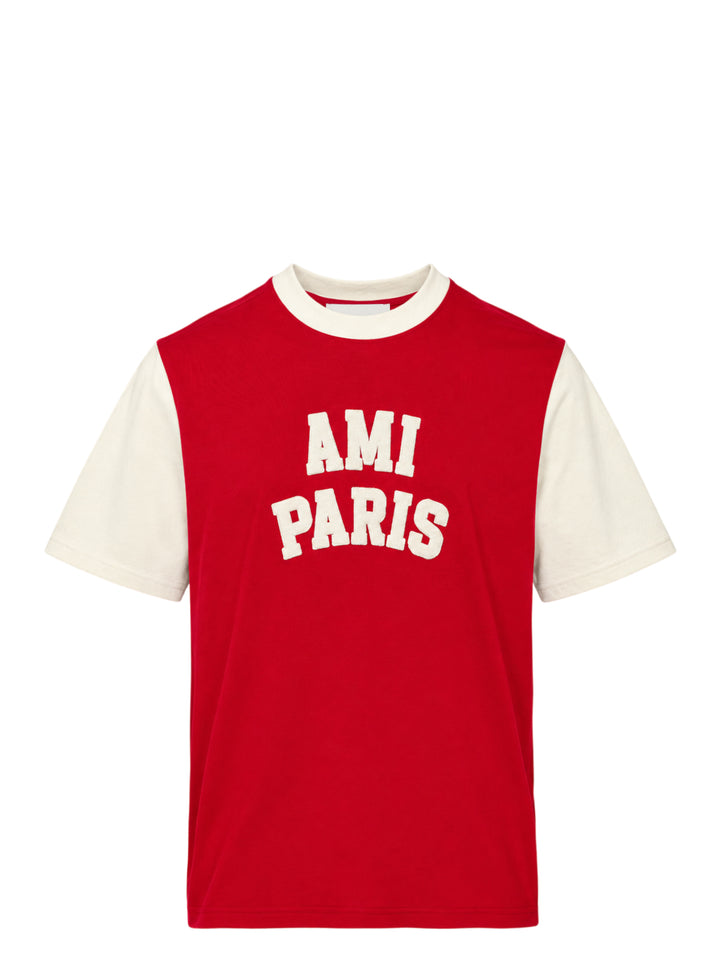 AMI Paris two-tone T-shirt with red body, ivory short sleeves and collar, and oversized white felt 'AMI Paris' collegiate lettering on the chest