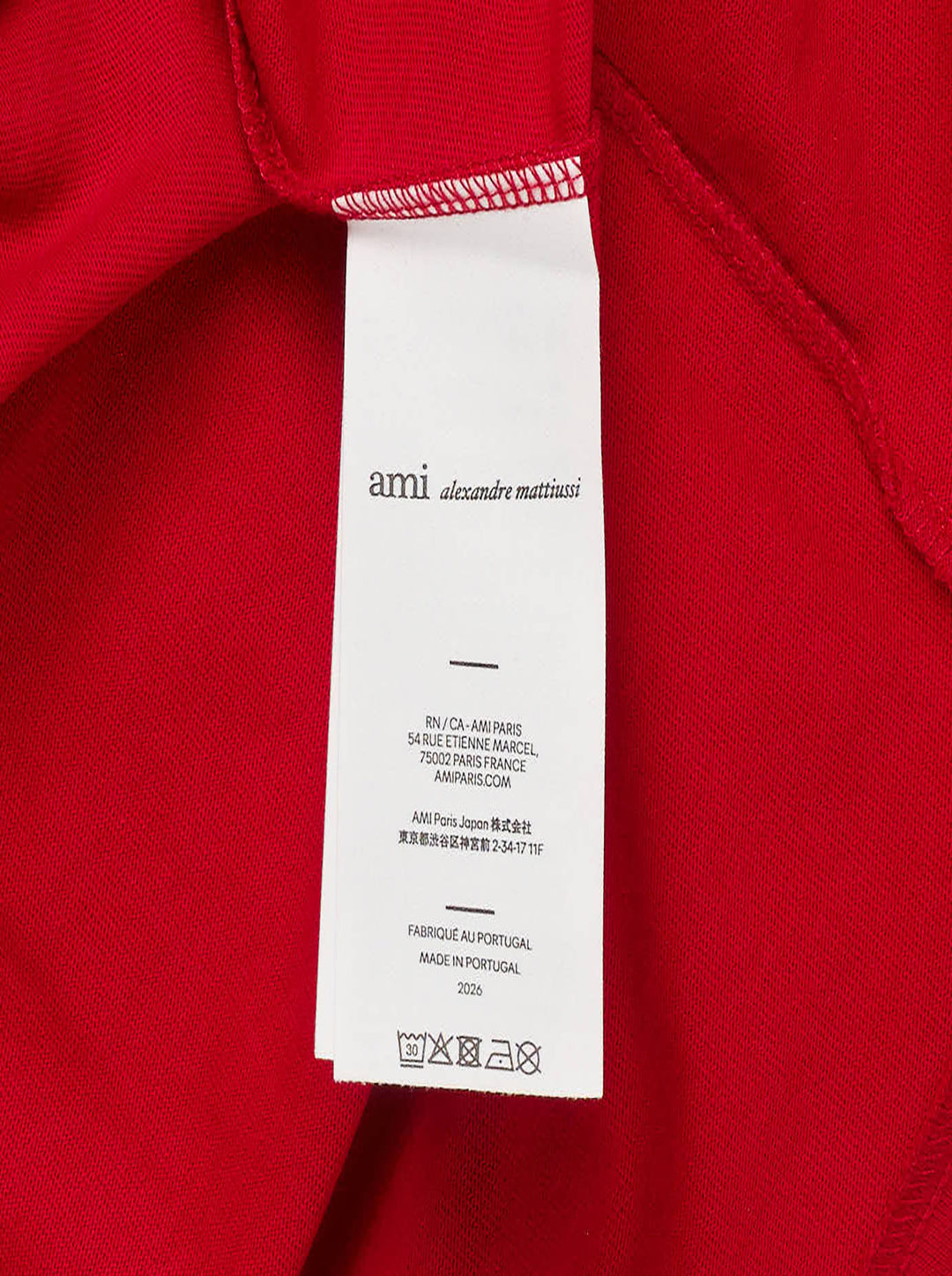 AMI Paris two-tone T-shirt with red body, ivory short sleeves and collar, and oversized white felt 'AMI Paris' collegiate lettering on the chest - view 4