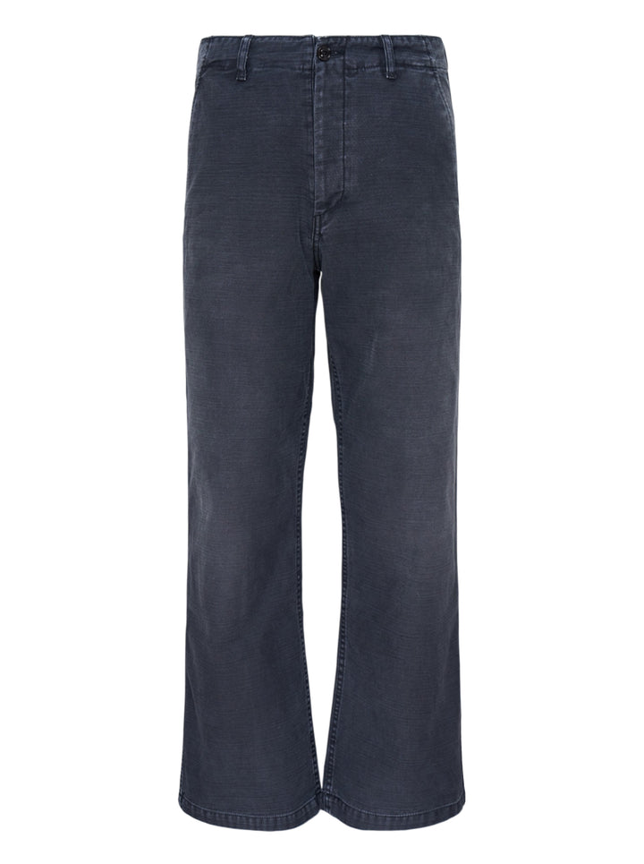 Our Legacy Rig Chino Pants in washed navy fine-wale corduroy, shown flat with a wide-leg silhouette and button fly closure