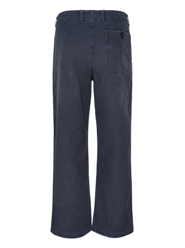 Our Legacy Rig Chino Pants in washed navy fine-wale corduroy, shown flat with a wide-leg silhouette and button fly closure - view 2