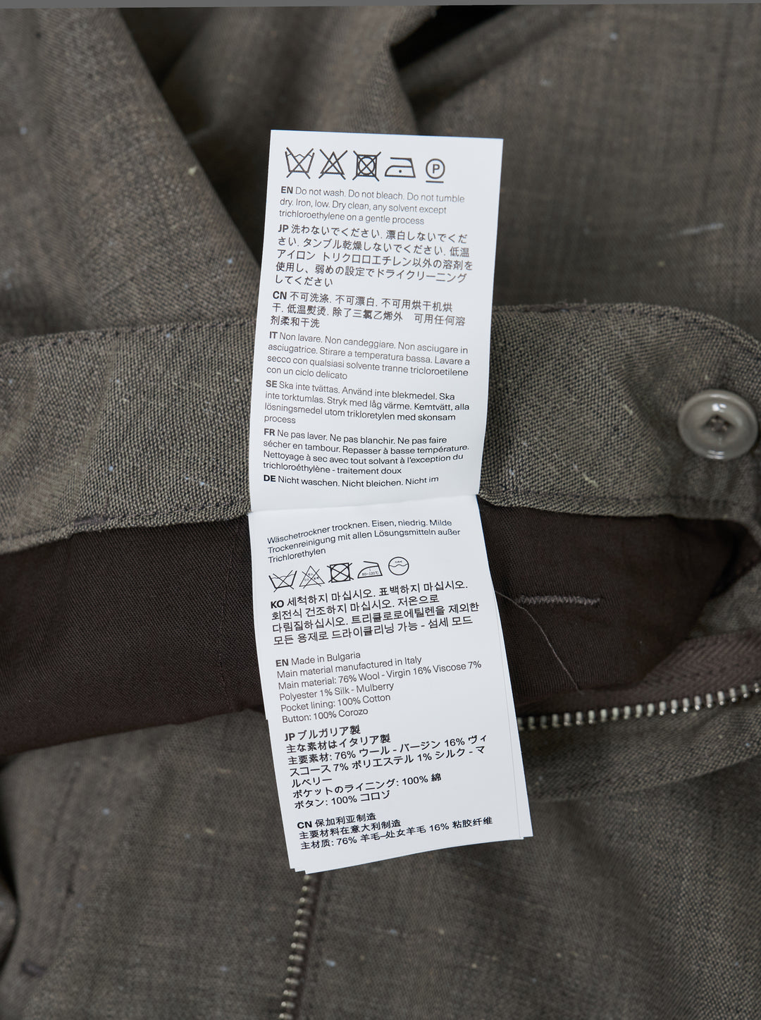 Our Legacy Still Chino Pants in heathered grey — wide-leg tailored trousers with double pleats and turn-up cuffs, front view on white background - view 3
