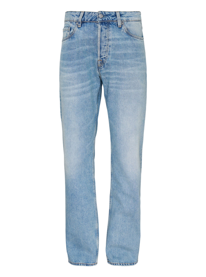 Our Legacy Slate Cut Jeans in light blue stonewash, relaxed straight-leg silhouette with five-pocket construction and vintage-style fading, front view on white background