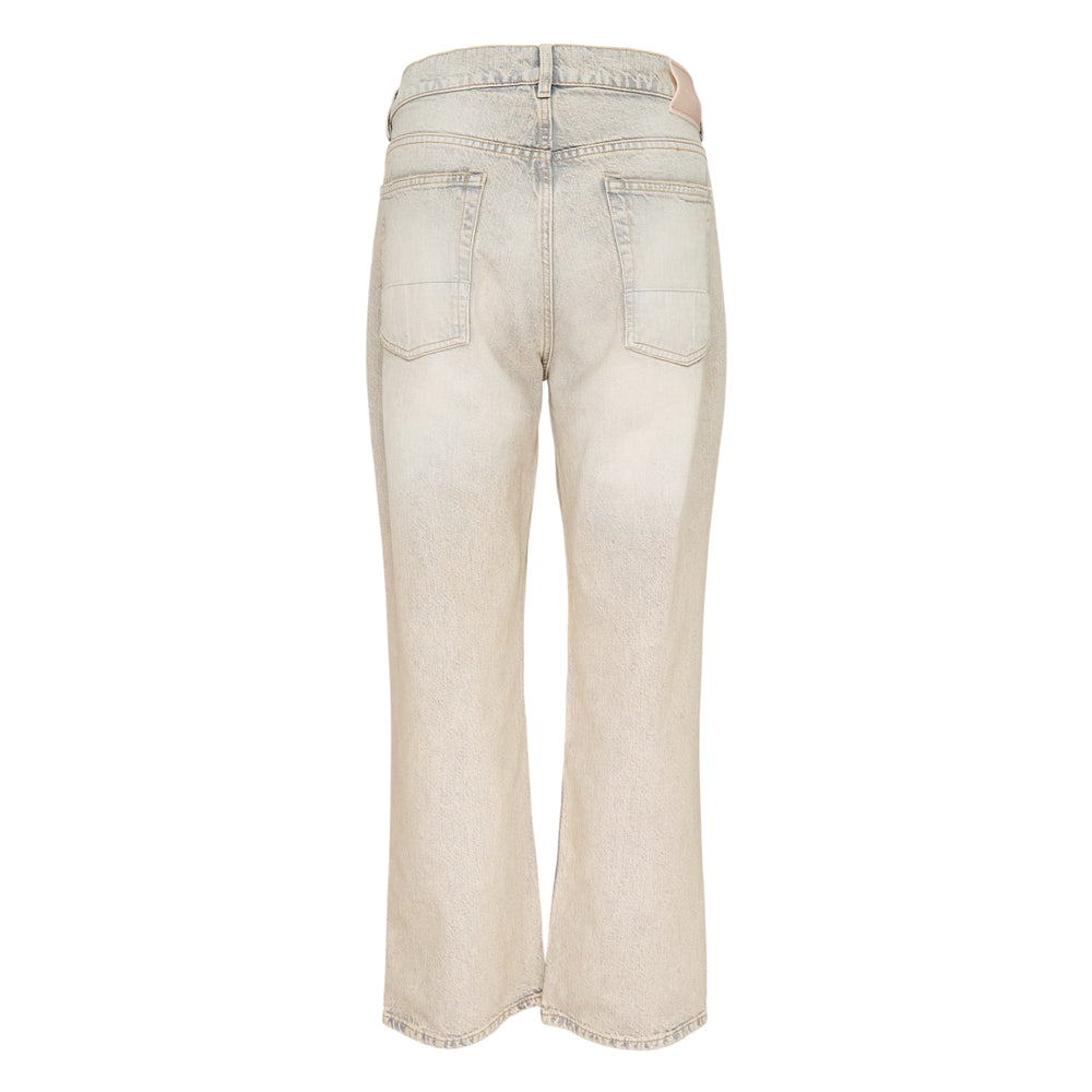 Our Legacy Third Cut Jeans in a heavily faded sandy beige wash with blue tonal shifts, featuring a high-rise waist, straight leg and cropped flare hem, shown flat on a white background