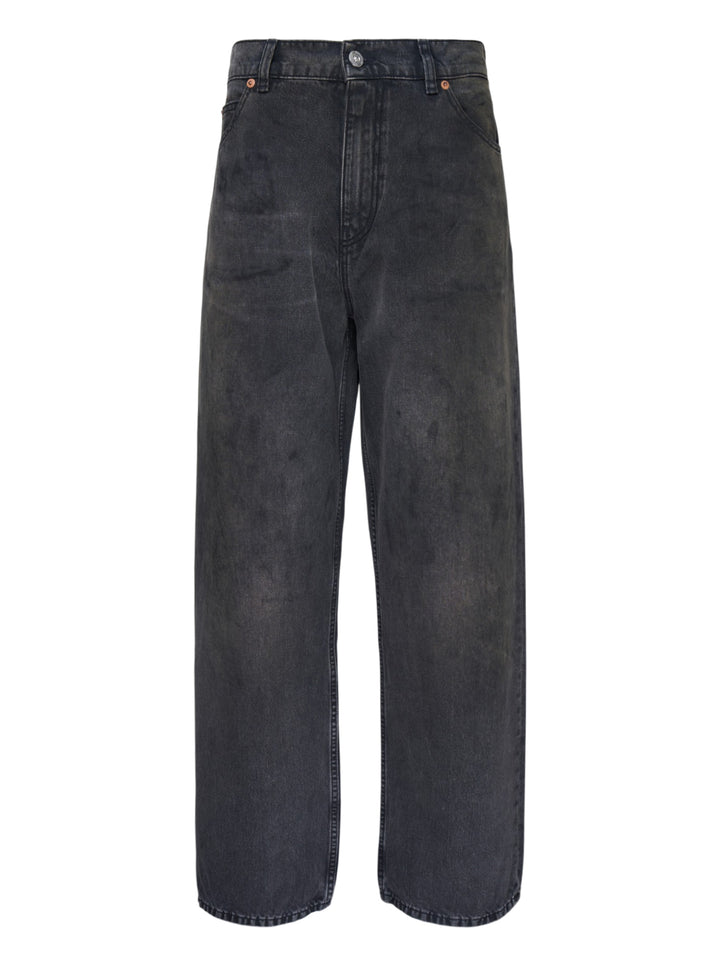 Our Legacy Vast Cut Jeans in washed black denim, featuring a wide-leg silhouette, high rise, copper rivets, and organic cloud-fade wash effect