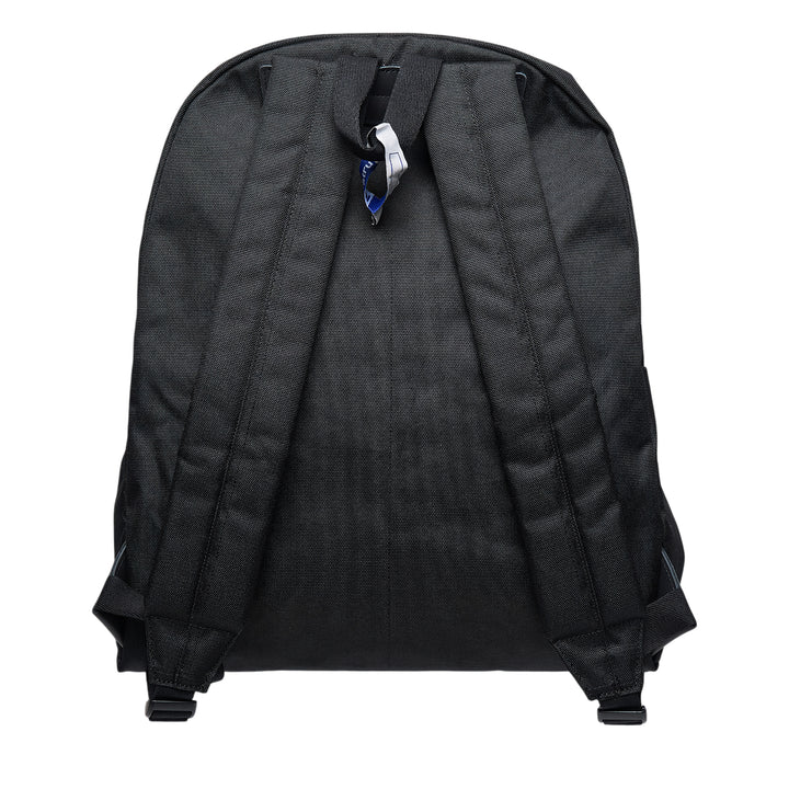 Mihara Yasuhiro in·stru(men·tal). large backpack in black canvas, front view showing zip closure, front pocket, woven brand label, and signature information-card patch with barcode and QR code detail