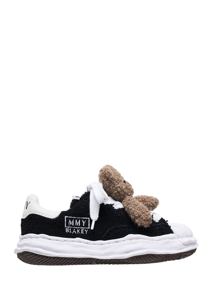 Mihara Yasuhiro Blakey low-top sneaker in black textured fabric with a brown teddy bear on the oversized white laces and a wavy white sole