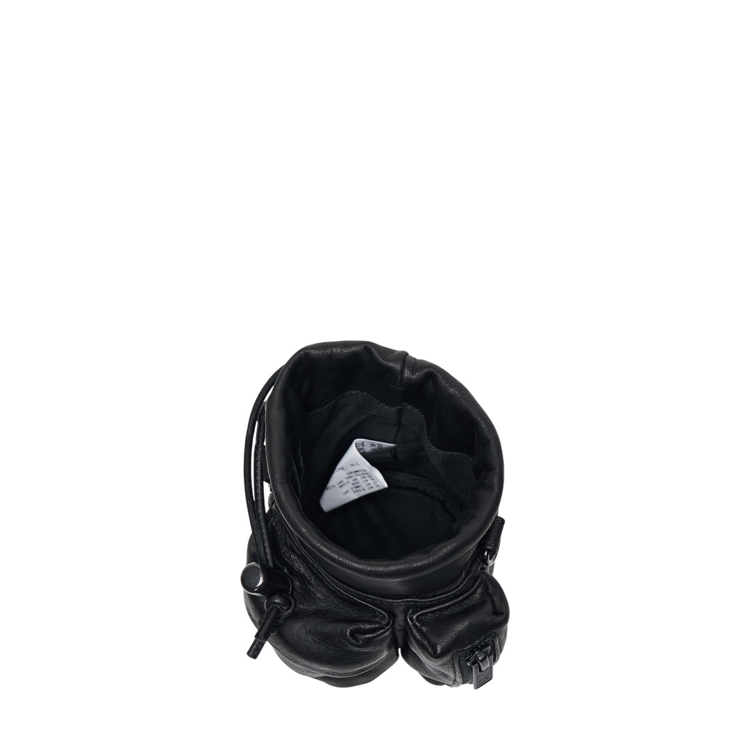 Y's 2 Way Mini Purse in black leather with long adjustable webbing crossbody strap, drawstring top closure, and exterior zip pocket, shown on white background - view 3