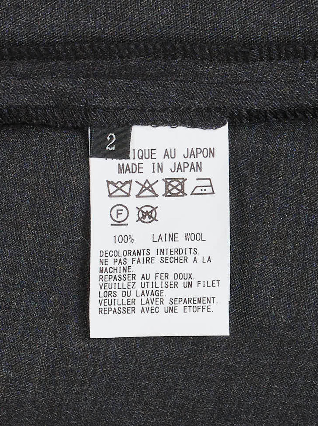 Y's charcoal grey wool salopette dress with crossover bib, buckled straps and oversized side pockets, shown from the front - view 3
