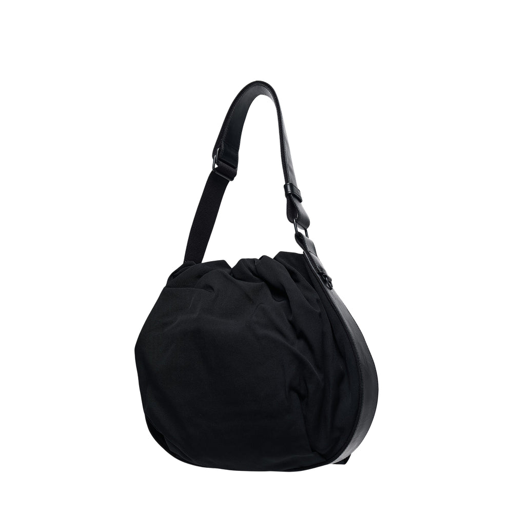 Y's Mini Purse Tote Bag in black, featuring a softly gathered nylon body, rounded silhouette, and adjustable leather shoulder strap with matte black hardware