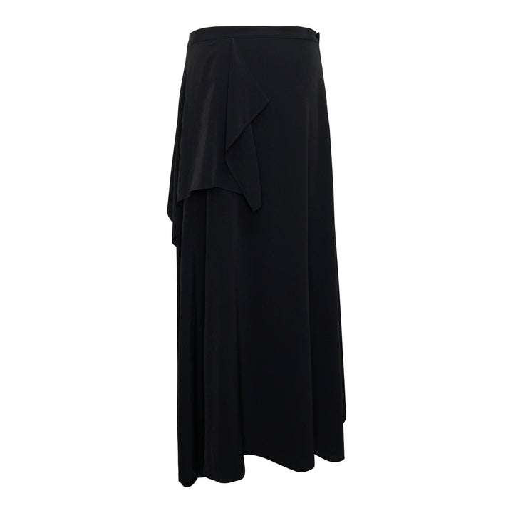 Y's black asymmetric drape midi skirt with layered ruffle overlay, panelled construction, and a sweeping flared hem, photographed flat on a white background