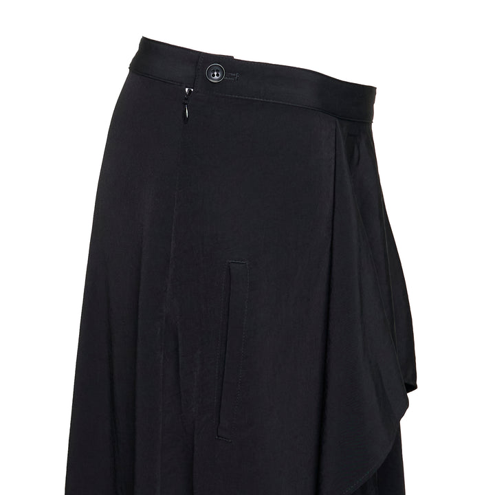 Y's black asymmetric drape midi skirt with layered ruffle overlay, panelled construction, and a sweeping flared hem, photographed flat on a white background