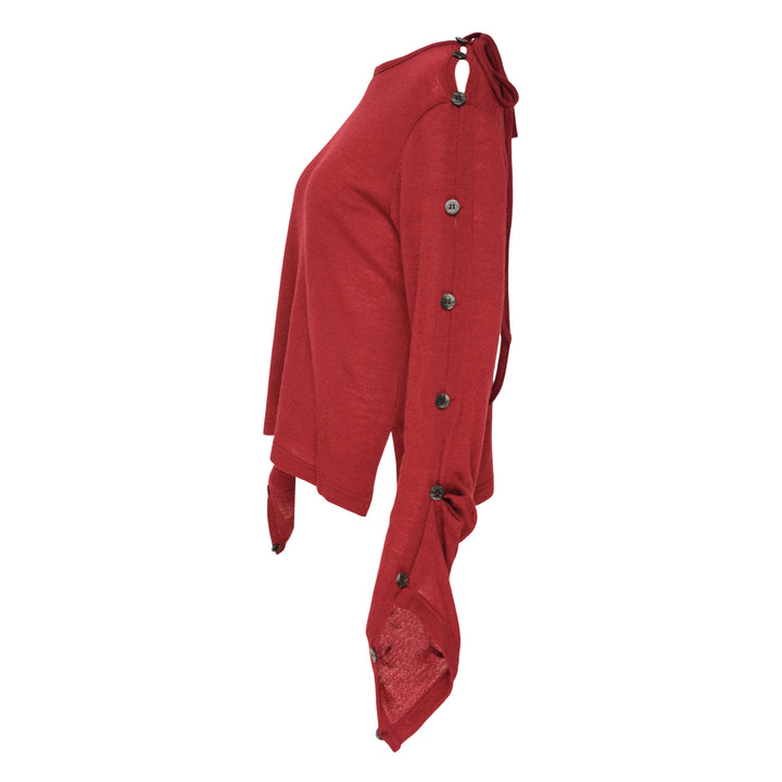 Y's red lightweight knit boat neck top with dark gunmetal buttons running along the full length of both long sleeves, shown flat on a white background - view 4