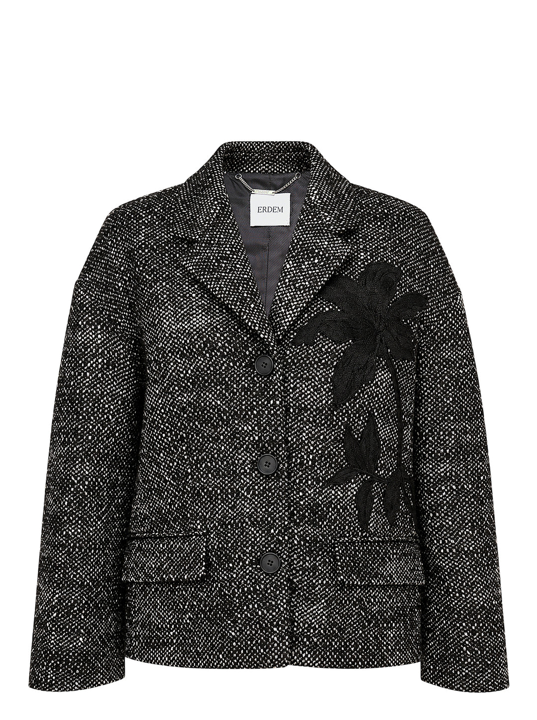 Erdem cropped jacket in salt-and-pepper wool tweed with notched lapels, three black buttons, flap pockets and a black botanical appliqué on the front