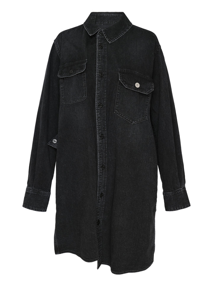 sacai oversized black washed denim shirt dress with dual chest patch pockets, mixed button hardware, full-length button front, and longline curved hem — flat lay on white background