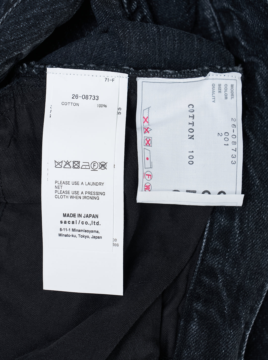 sacai belted wide-leg denim shorts in washed black with front pleats, contrast stitching, and an integrated metal-buckle belt - view 3