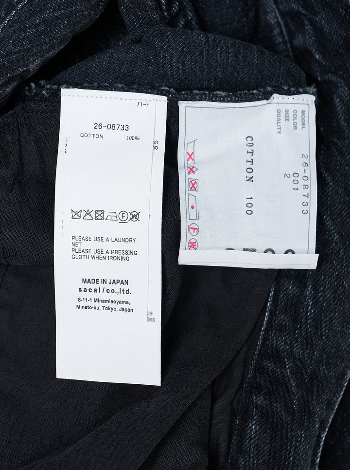 sacai belted wide-leg denim shorts in washed black with front pleats, contrast stitching, and an integrated metal-buckle belt - view 3