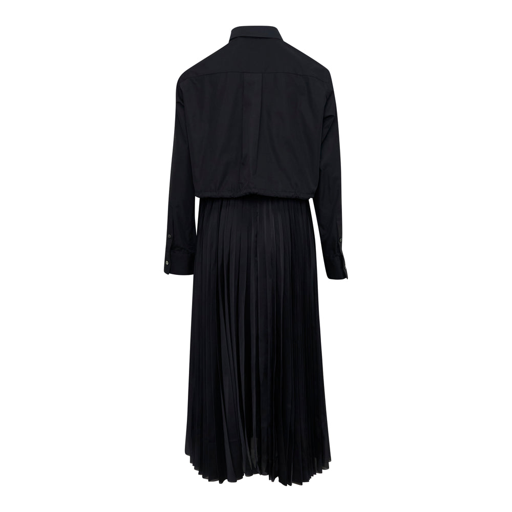 sacai Poplin x Satin Pleated Dress in black, featuring a structured shirt bodice with point collar and concealed placket over a fluid accordion-pleated midi skirt, displayed flat on a white background - view 2