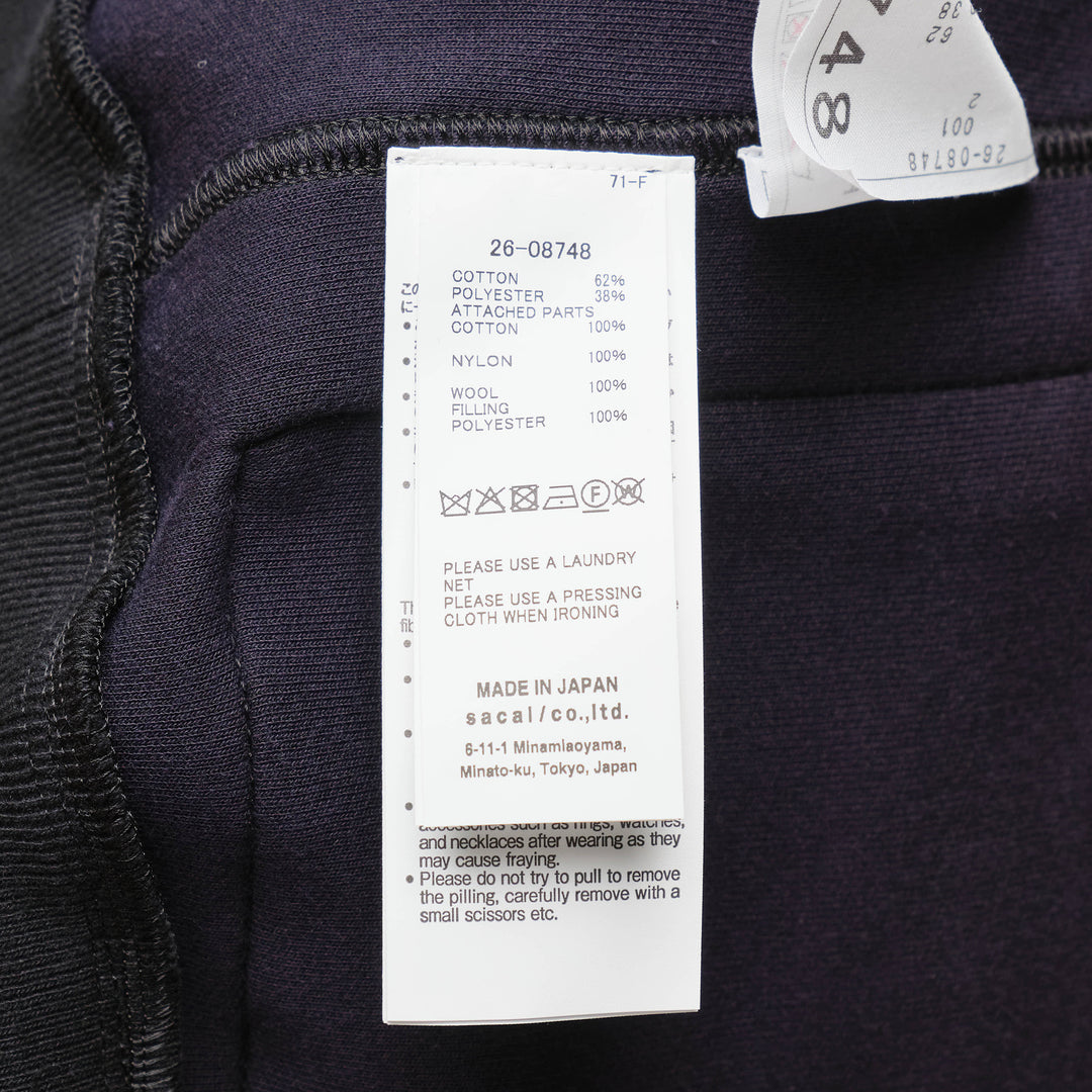 sacai Sponge Sweat Blouson in black, featuring a quilted nylon bib front, oversized spread collar, four cargo pockets, grommet strap detail, and ribbed cuffs - view 3