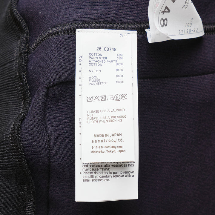 sacai Sponge Sweat Blouson in black, featuring a quilted nylon bib front, oversized spread collar, four cargo pockets, grommet strap detail, and ribbed cuffs - view 3