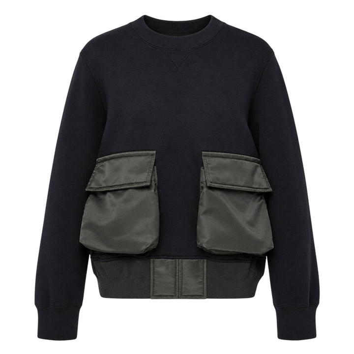 sacai Sponge Sweat Cargo Pullover in black with contrast olive nylon cargo pockets and bomber-style nylon hem panel, front view