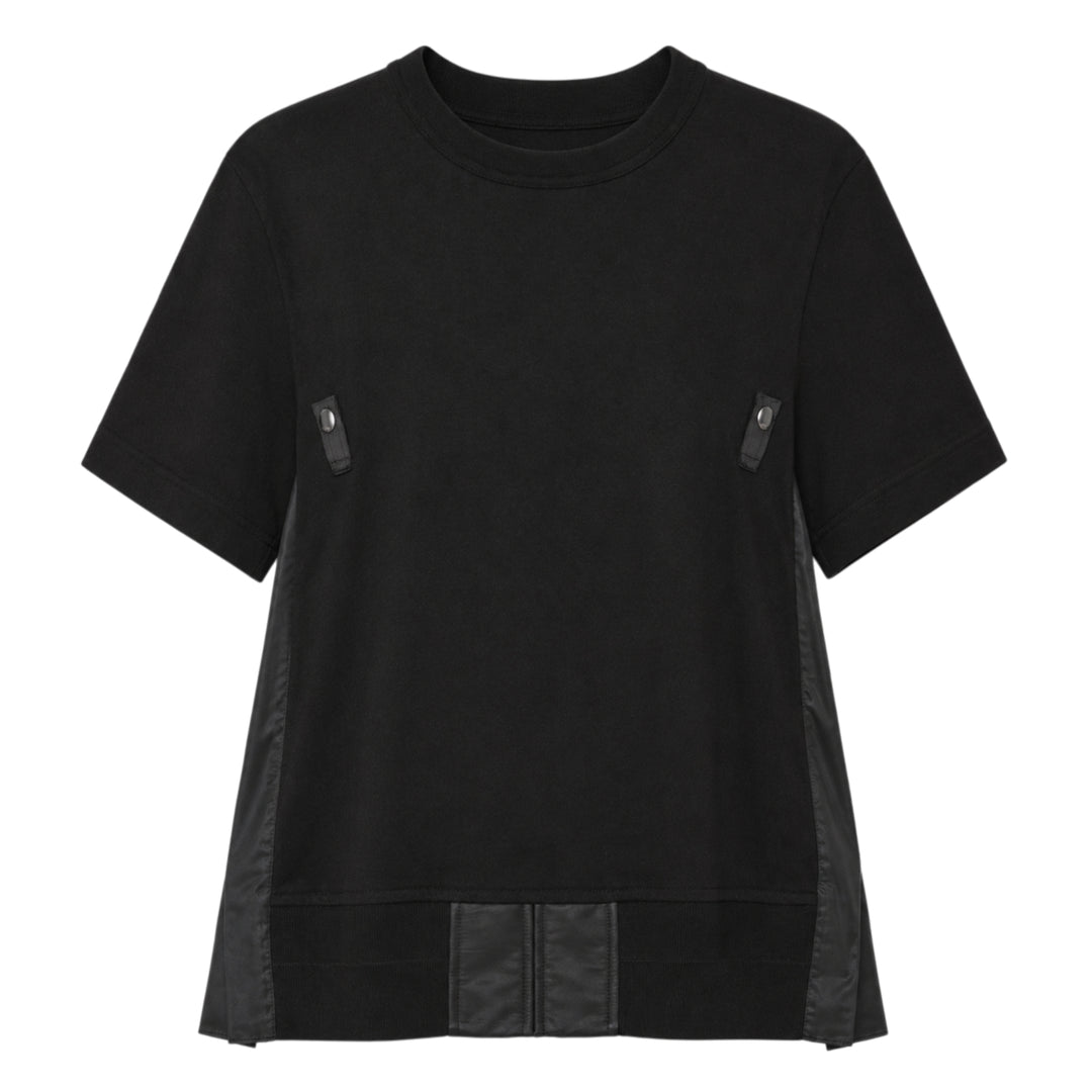 sacai Nylon Twill Cotton Jersey Tee in black, featuring snap-button chest tabs, nylon twill side panels, and a flared panelled hem