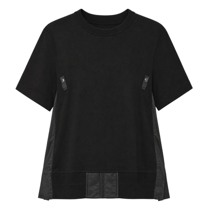 sacai Nylon Twill Cotton Jersey Tee in black, featuring snap-button chest tabs, nylon twill side panels, and a flared panelled hem