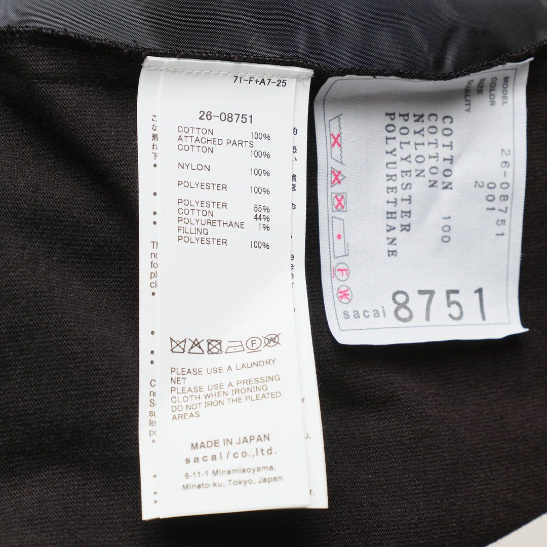 sacai Nylon Twill Cotton Jersey Tee in black, featuring snap-button chest tabs, nylon twill side panels, and a flared panelled hem - view 3