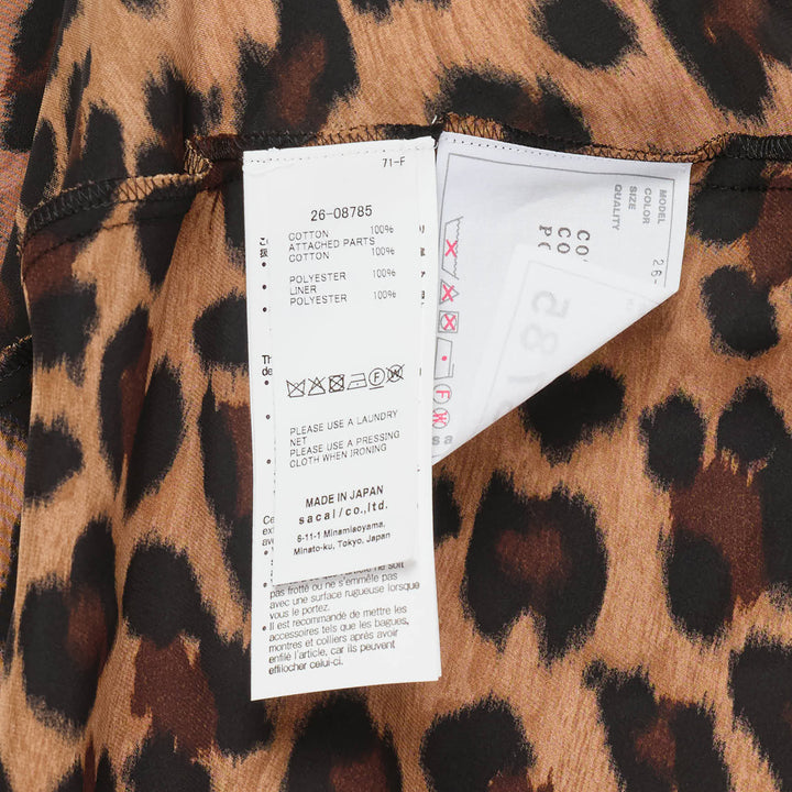 sacai Leopard Cotton Jersey Dress with black crew-neck t-shirt bodice, contrast leopard-print sleeve panels, and fluid leopard-print A-line midi skirt - view 3