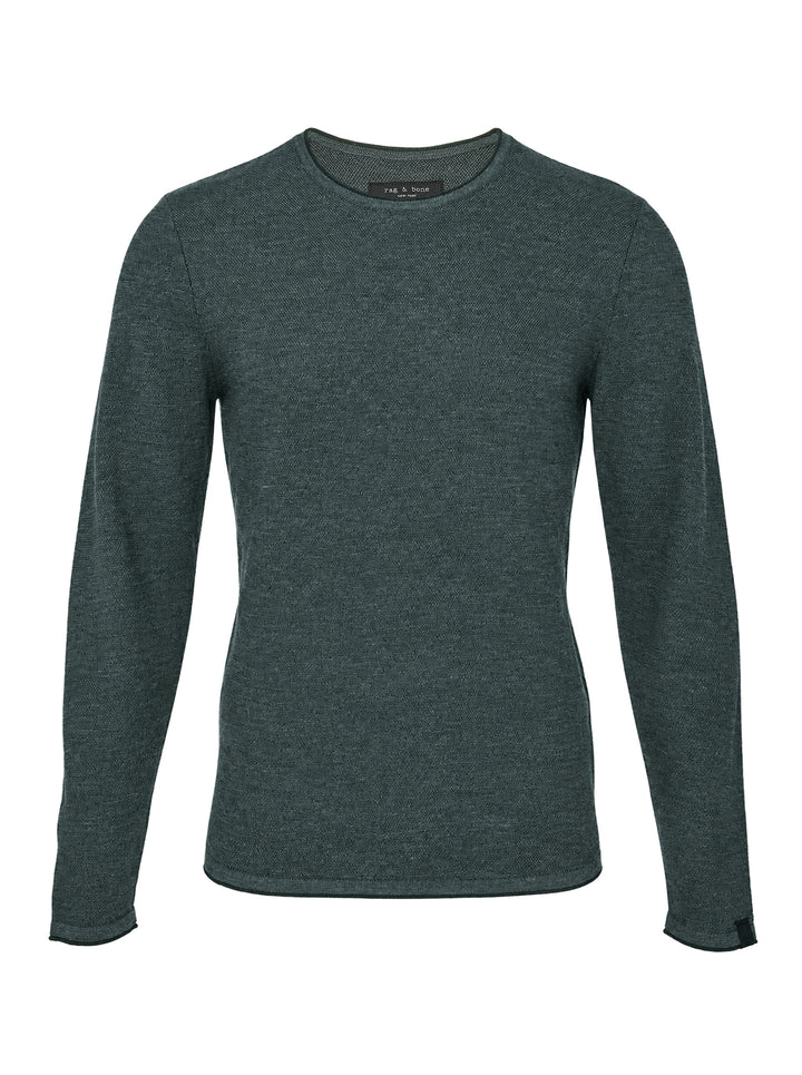 rag & bone Brooks Wool Crew Sweater in deep teal, featuring a slim fit, crew neckline, long sleeves, and raw-edge cuffs, displayed on a flat ghost mannequin