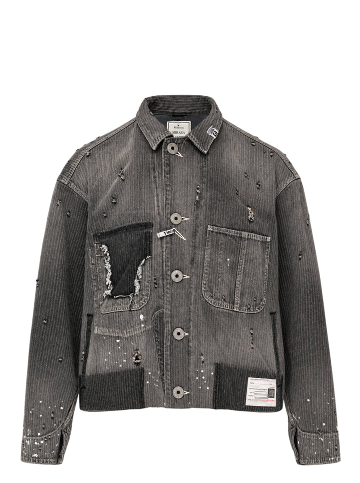 Faded grey pinstripe denim chore jacket with distressed detailing, paint splatter, patchwork pockets and oversized metal buttons