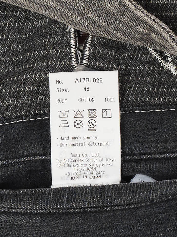 Faded grey pinstripe denim chore jacket with distressed detailing, paint splatter, patchwork pockets and oversized metal buttons - view 3