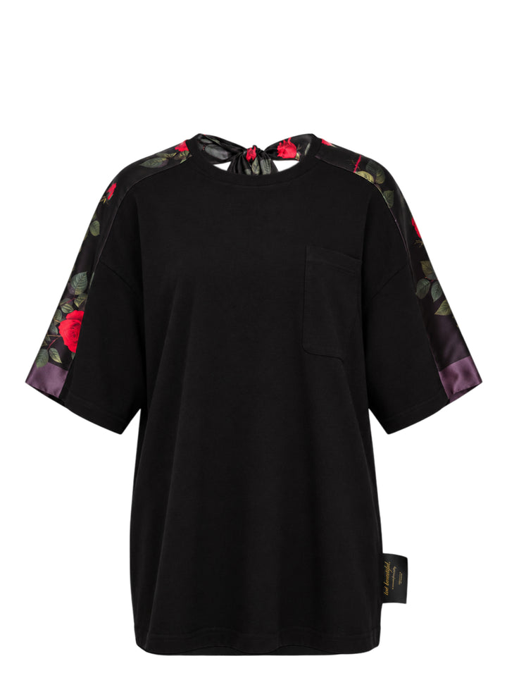 Undercover Floral Sleeve Panel Tee in black with rose-print satin sleeve panels, chest pocket and knotted satin tie at the back neckline