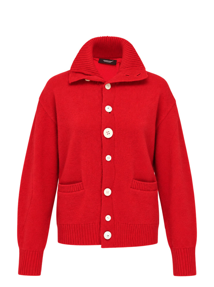 Undercover asymmetrical red wool knit cardigan with ribbed funnel collar, graduated pearlescent buttons and patch pockets