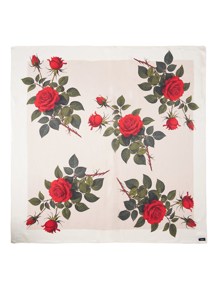 Undercover square scarf printed with five clusters of red roses, buds, and green leaves on an ivory ground with a pale border