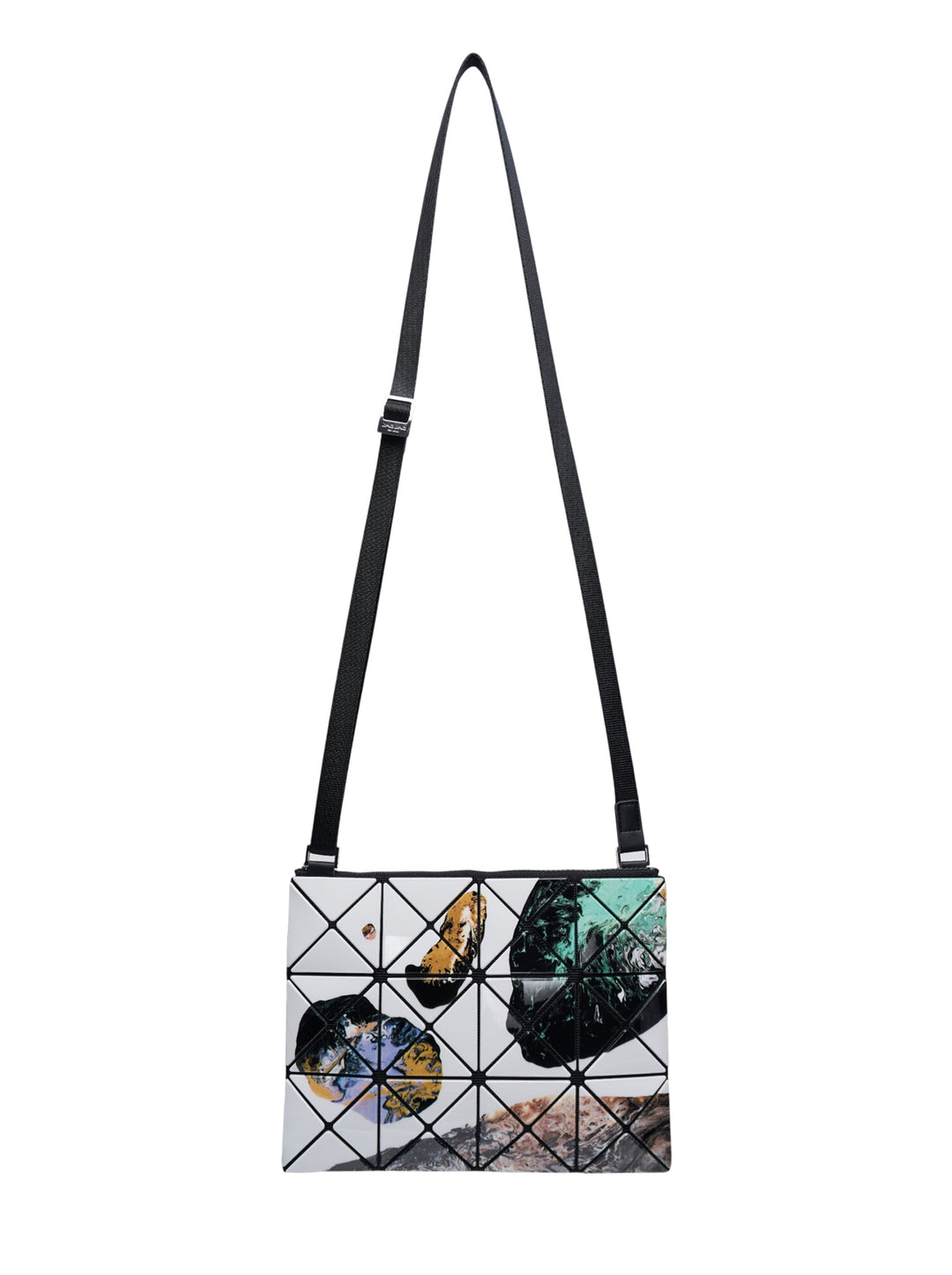 Bao Bao Issey Miyake Cosmic Crossbody Bag with geometric triangulated tile panels featuring an abstract photographic print in white, black, teal, and gold, with an adjustable black strap and silver-tone hardware