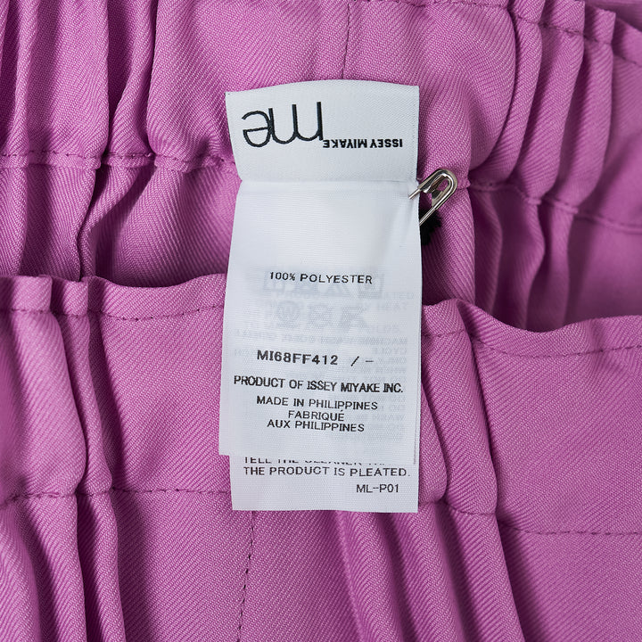 me Issey Miyake Tower Pleats Bottom in black — wide-leg cropped pants with deep vertical pleating and elasticated waistband, shown flat on white background