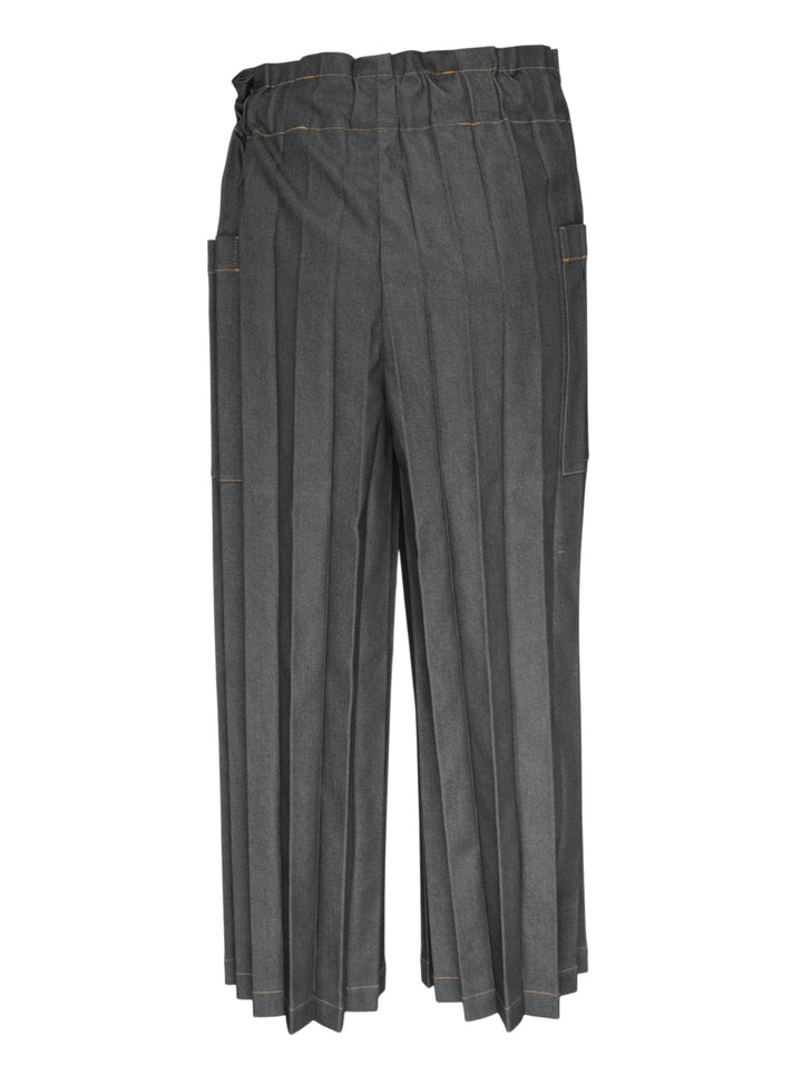 me Issey Miyake Denim Pleats Bottom in grey — wide-leg pleated pants with contrast amber topstitching, asymmetric wraparound waistband, single button closure, and patch pockets - view 2