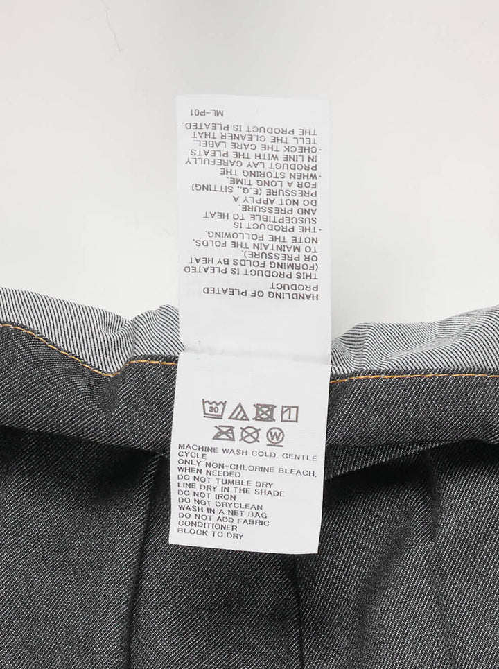 me Issey Miyake Denim Pleats Bottom in grey — wide-leg pleated pants with contrast amber topstitching, asymmetric wraparound waistband, single button closure, and patch pockets - view 3