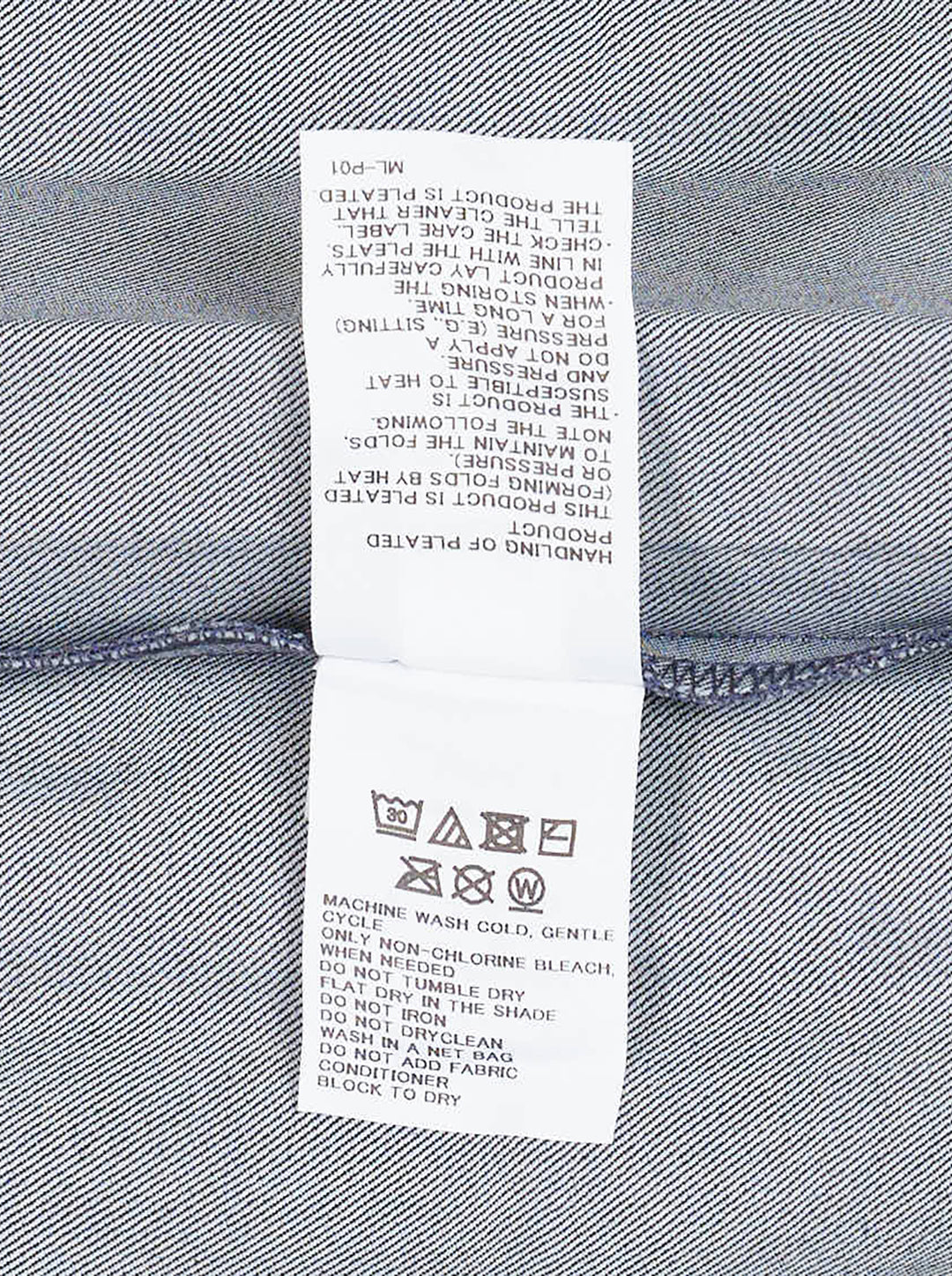 me Issey Miyake Denim Pleats Bottom jumpsuit in raw indigo denim, featuring deep vertical pleats, a square bib, knotted bow shoulder straps, patch hip pockets, and golden contrast topstitching - view 4