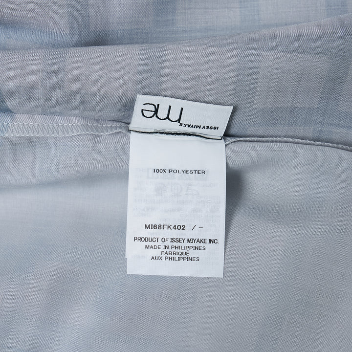 me Issey Miyake Building Print Cap Sleeve Top featuring an all-over graphic print of silhouetted urban buildings and botanical foliage in black, white, and muted violet-grey, shown from the front against a white background
