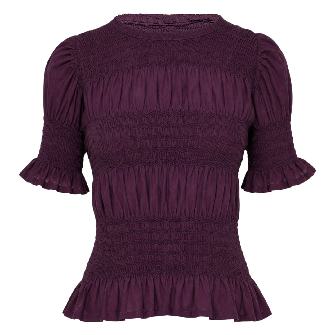 me Issey Miyake Shrink Stripe Short Sleeve Top in black, featuring horizontal smocked banding, puff sleeves with ruffle cuffs, and a flounced peplum hem, displayed on a flat lay against a white background